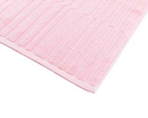 Opened pink cotton bath mat by Idaman Suri