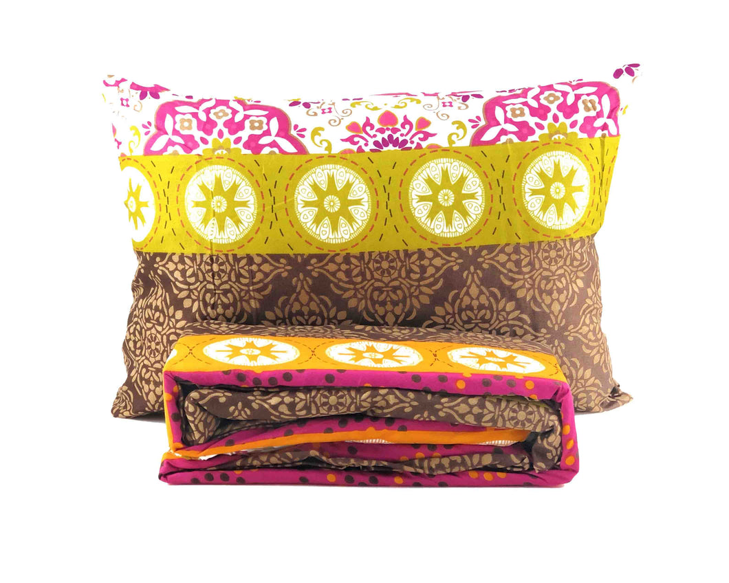 1 floral abstract pillow and folded fitted sheet