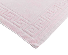 Opened light pink cotton bath mat by Idaman Suri