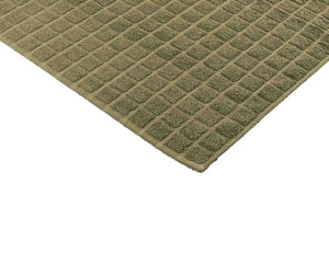 Opened navy green cotton bath mat by Idaman Suri