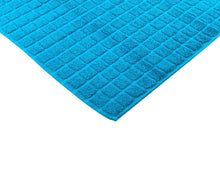 Opened light blue cotton bath mat by Idaman Suri