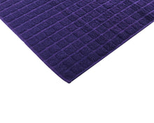 Opened purple cotton bath mat by Idaman Suri