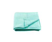 Folded Turquoise Cotton Towel by Idaman Suri