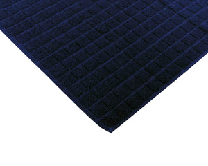 Opened dark blue cotton bath mat by Idaman Suri