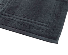 Opened grey cotton bath mat by Idaman Suri